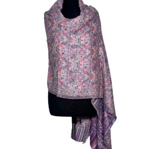 A light-colored Kani semi-pashmina shawl with pink and purple floral patterns draped on a mannequin.