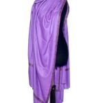 A lilac purple shawl with intricate gold embroidery along the border is draped elegantly over a black mannequin, set against a plain white background.