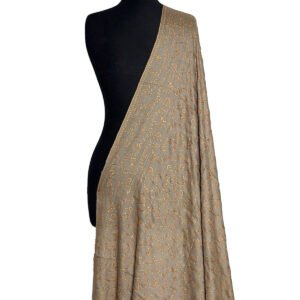 A full view of a light beige or sand-colored semi-pashmina shawl draped elegantly on a black mannequin, featuring subtle, light-colored floral and swirling "jaal" embroidery patterns.
