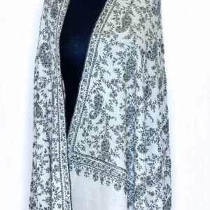 A close-up of a luxurious pure Pashmina Jaal shawl featuring intricate, delicate hand-embroidered floral and vine patterns in a traditional Kashmiri style. The fabric appears soft and finely woven, showcasing the detailed 'jaal' (net) work.